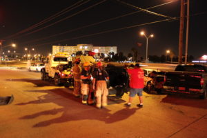 bystanders crowing around a car accident